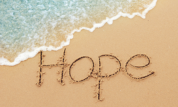 Hope message on the beach sand.